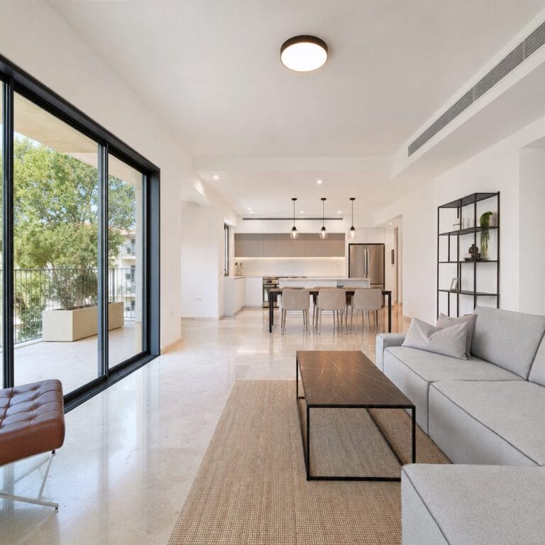 Living and dining room in the four-bedroom Hakalir Rechavia apartment