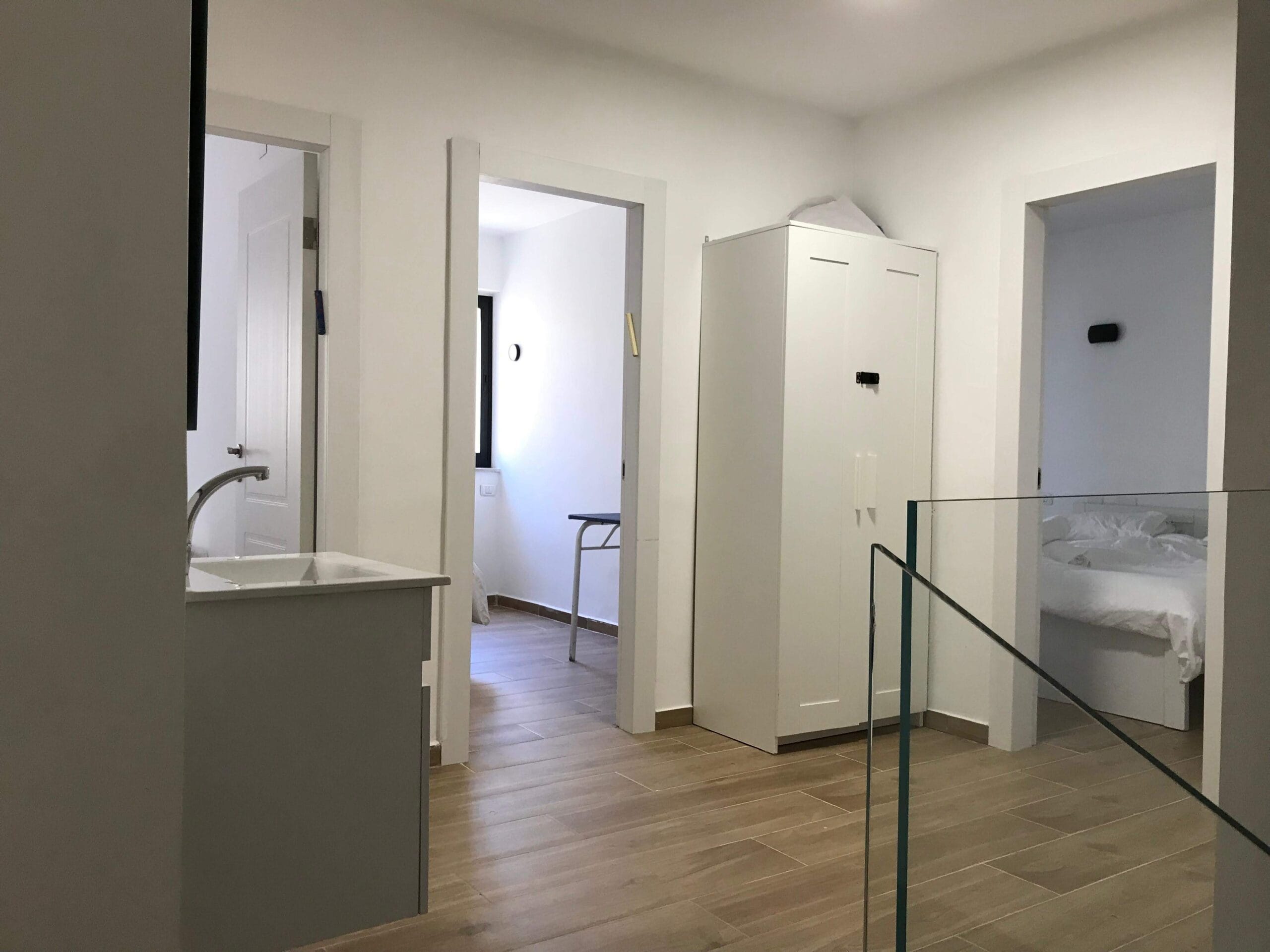 Hallway and bedroom entrances in spacious apartment