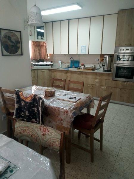 Kitchen and dining area in Old City family apartment near the Kotel