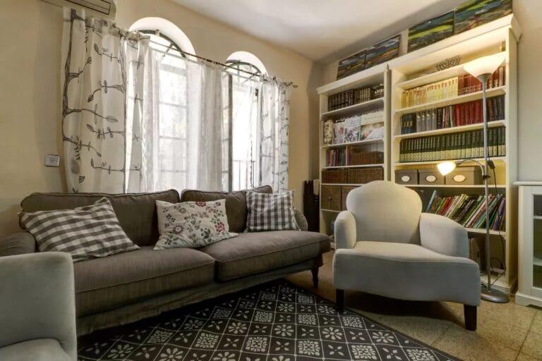 Sitting room with arched windows in the four-bedroom Old City apartment