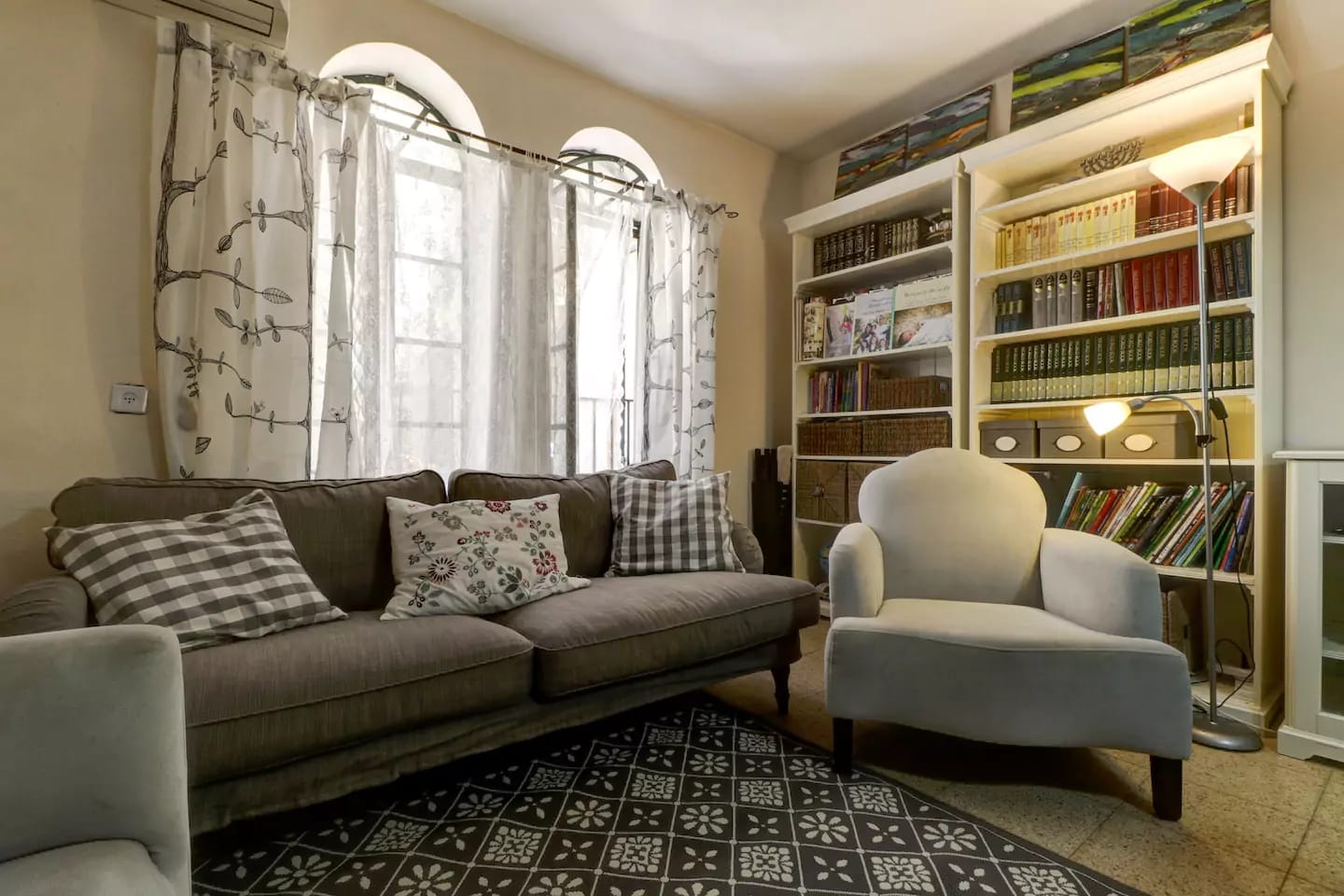 Sitting room with arched windows in 4 bedroom Old City apartment