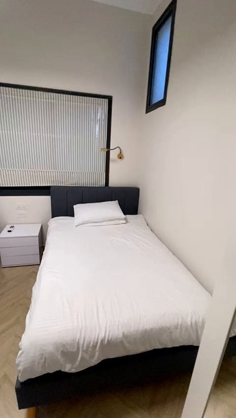 Bedroom detail with separate bed in the 2 bedroom KKL Shaarei Chessed apartment