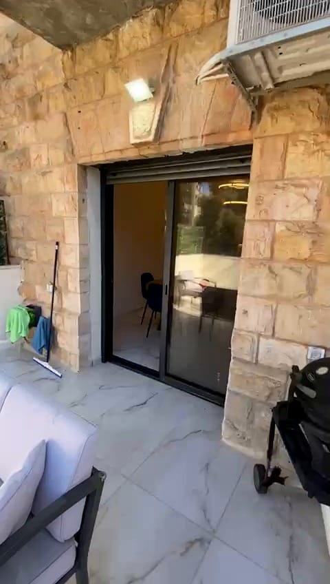 Exterior access to the 2 bedroom KKL Street vacation rental in Shaarei Chessed