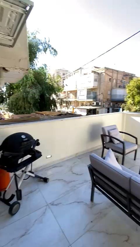 Outdoor seating area at the 2 bedroom KKL Shaarei Chessed vacation rental