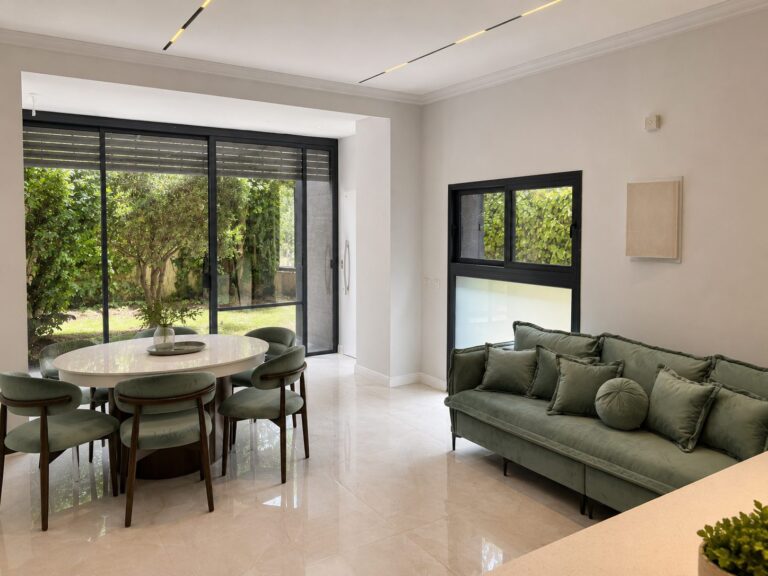 Ramban Rechavia apartment living room overlooking the private garden