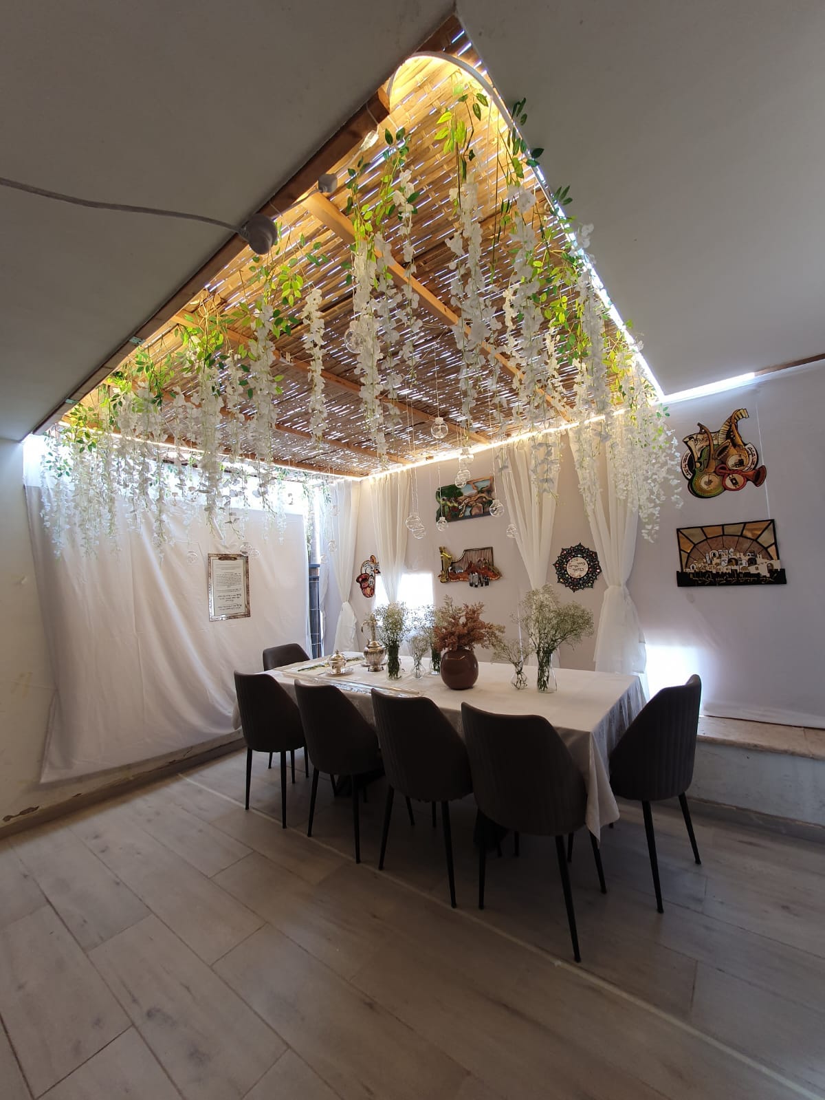 Large decorated sukkah at the Yirmiyahu Romema apartment