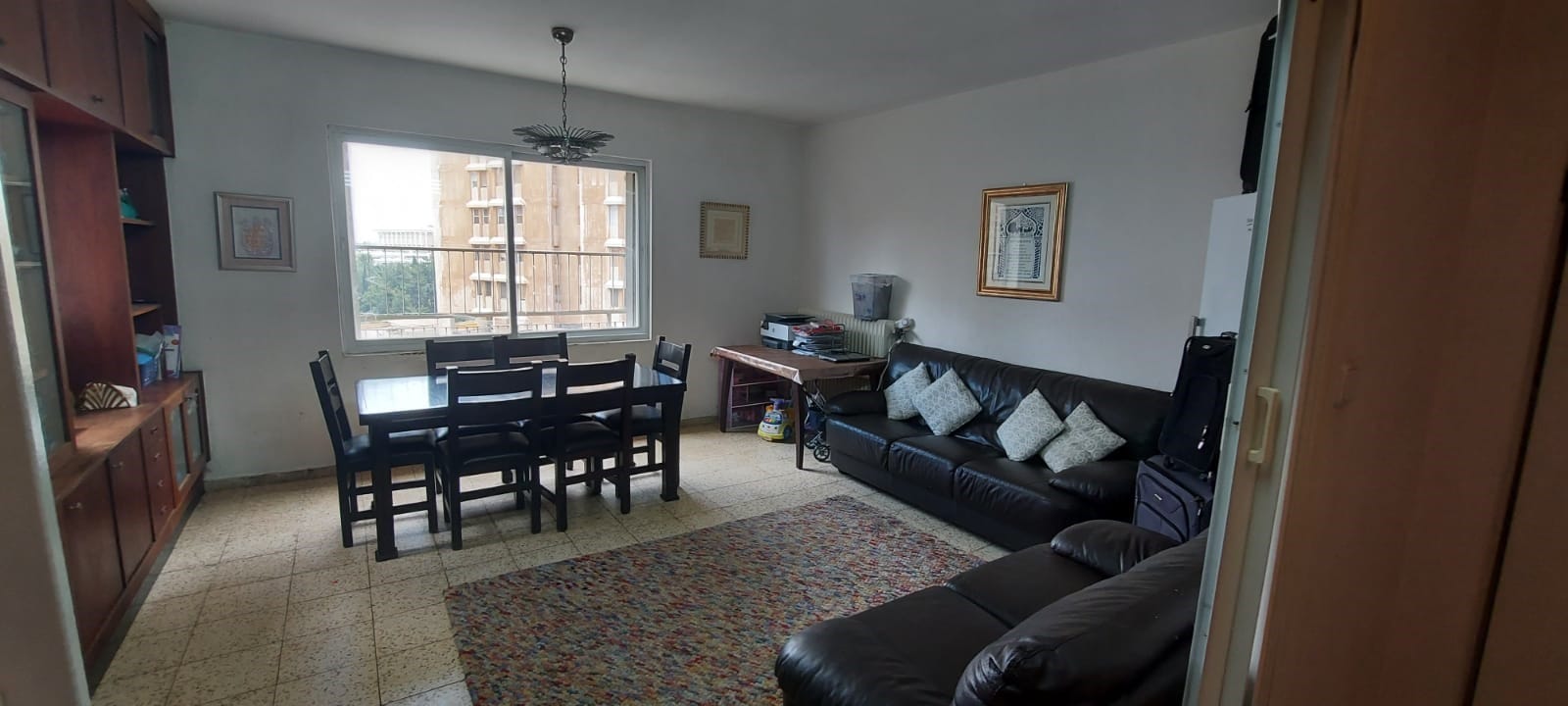 Living and dining room in the four-bedroom Old City apartment near the Kotel