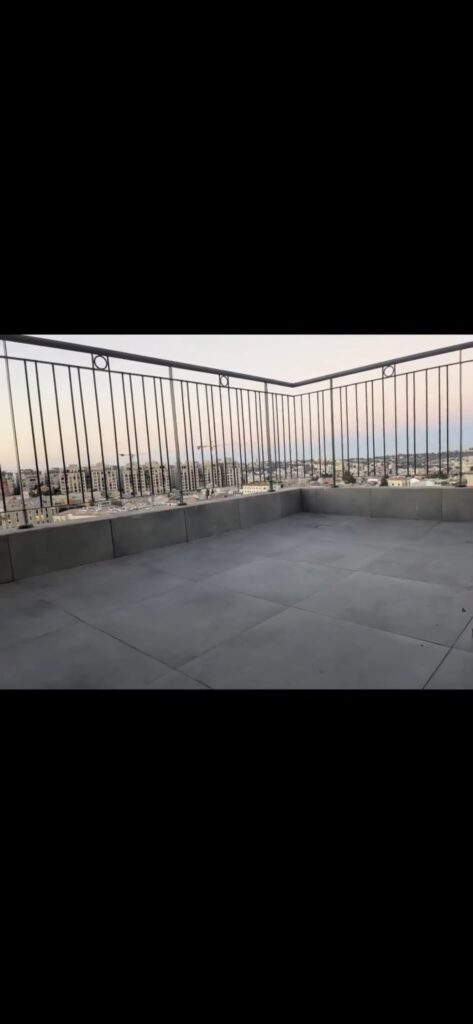 Tiled balcony with Jerusalem views at the Navon apartment in Mekor Baruch