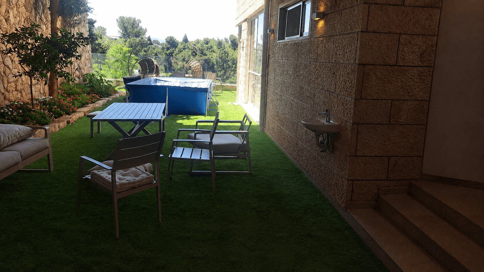 Private garden seating and dining area at the Wolfson Villa in Rechavia, Jerusalem.