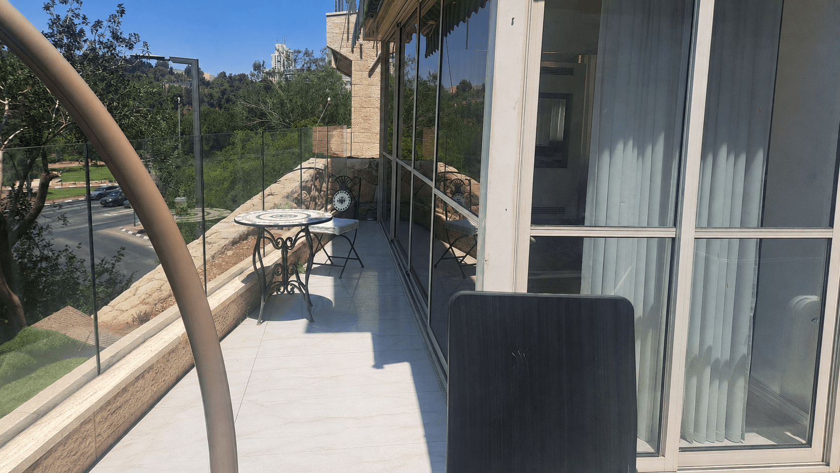 Private panoramic terrace overlooking Gan Sacher at the Wolfson Villa in Rechavia, Jerusalem.