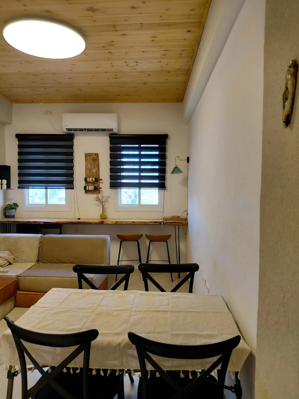 Dining area and spacious lounge in the Machane Yehuda rooftop Jacuzzi suite