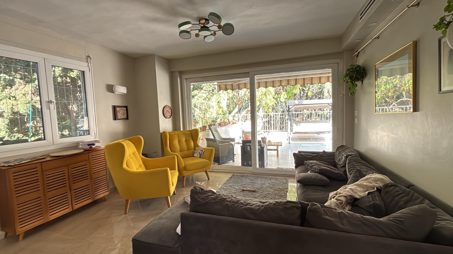 Spacious living room opening onto private terrace in Afodi Street Rehavia apartment