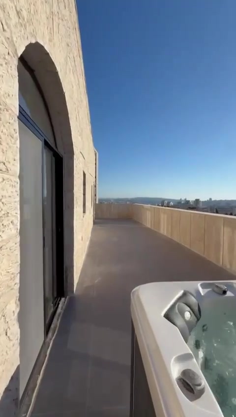 Long private rooftop terrace with panoramic Jerusalem views at the Eliash Street penthouse