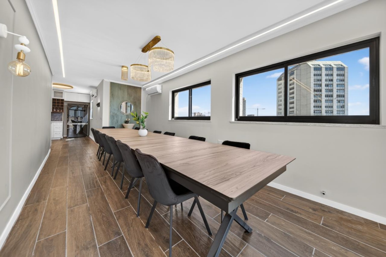 Wide view of the large penthouse dining room and Jerusalem skyline from Eliash Street
