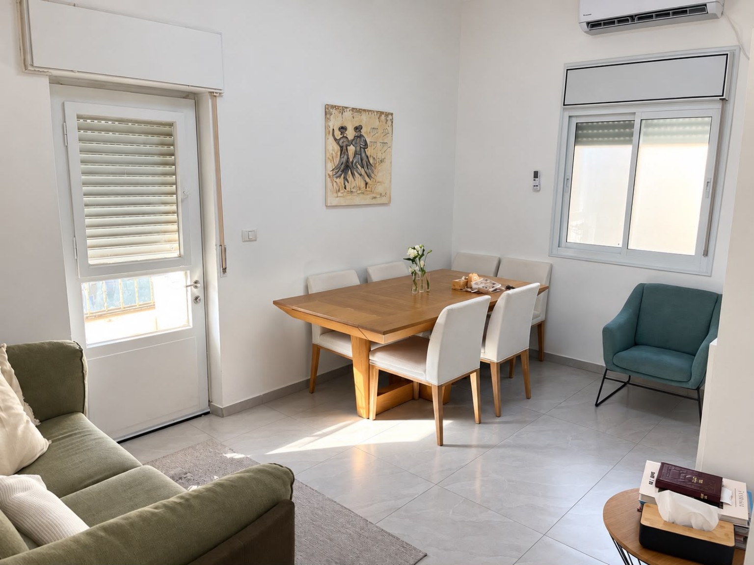 Bright living and dining room in the Ussishkin and Menorah Street Shaarei Chesed Sukkot apartment