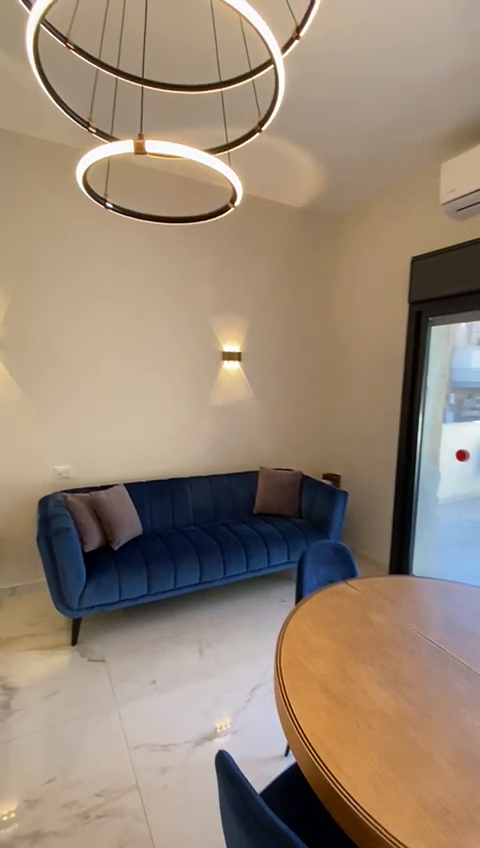 Living and dining area at Keren Keyemet L’Yisrael Apartment